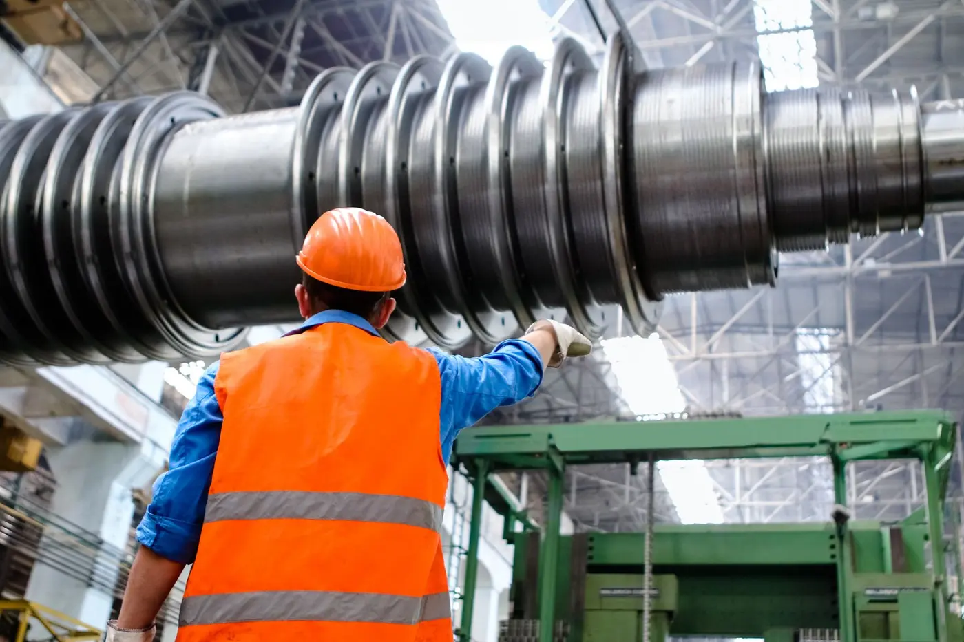 Engineer checking a machined hydraulic shaft